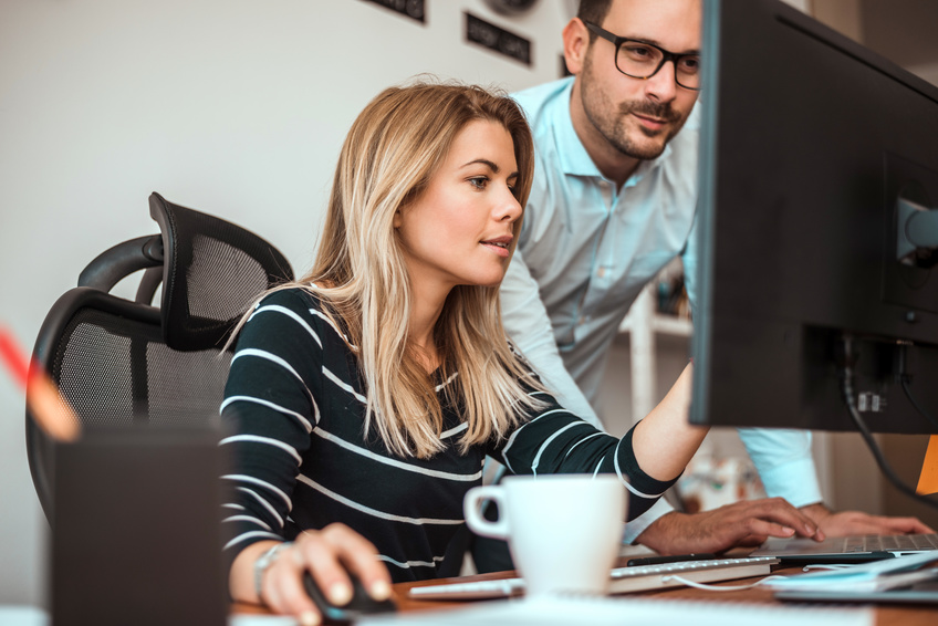 Young business people working together in modern office.